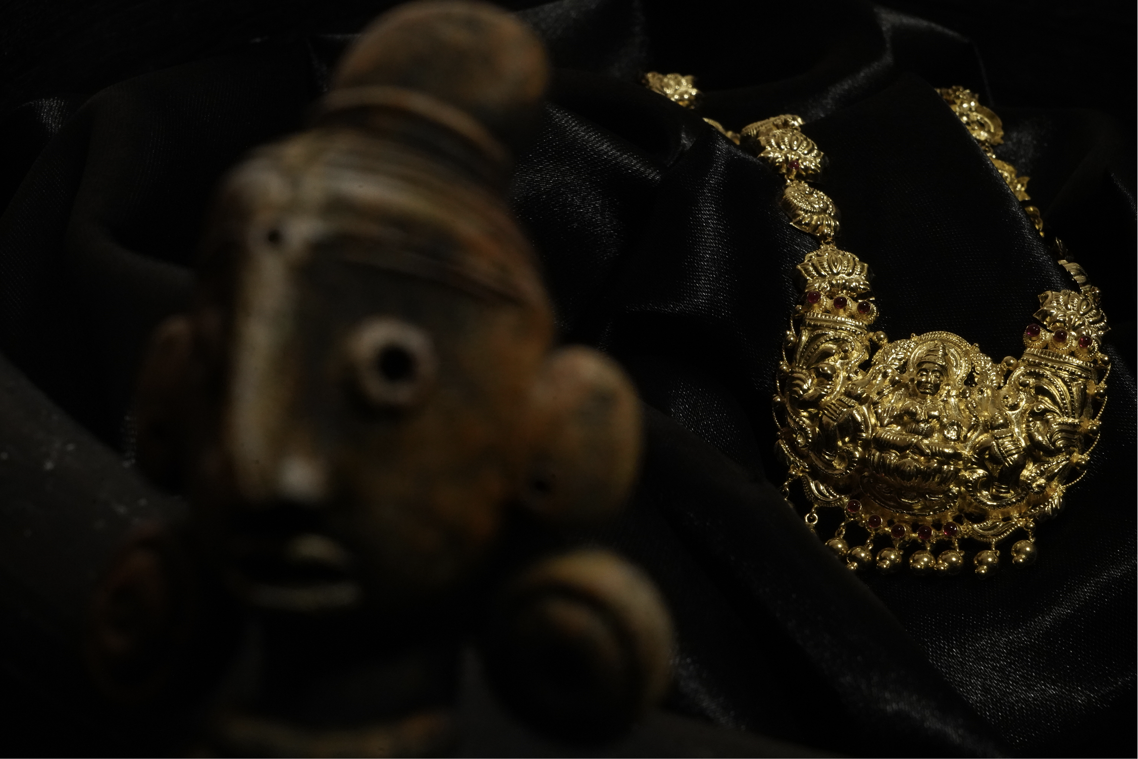 Gold necklace with brass lamps