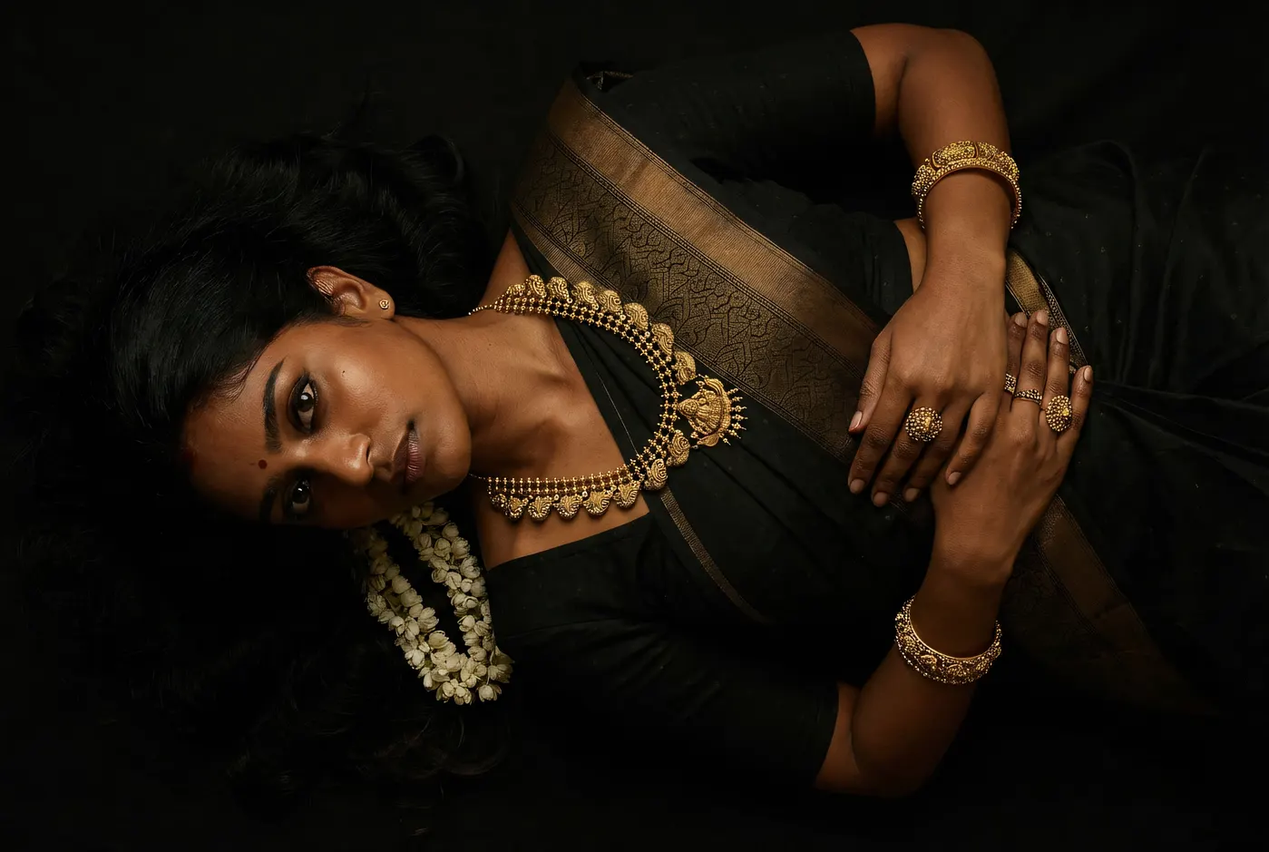 Fine art editorial portrait with layered temple gold necklace